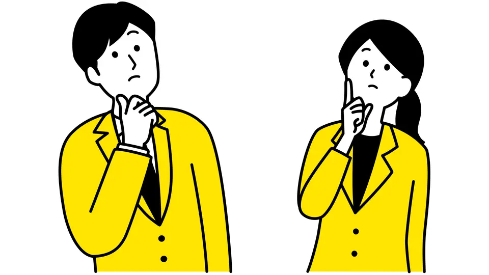上を見上げて考えるスーツ姿の男女