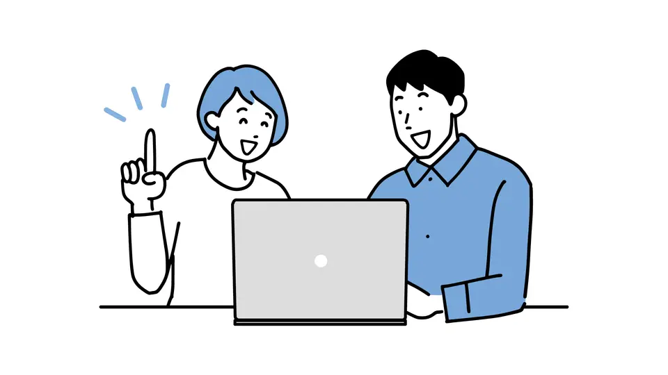 パソコンを見ながら楽しく話し合う夫婦