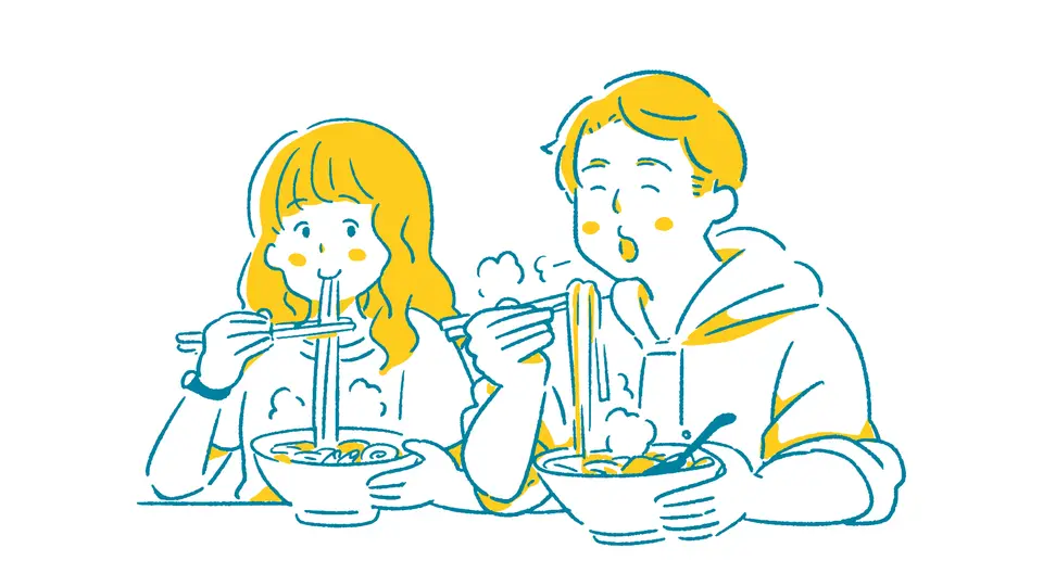 ラーメンを食べるカップル