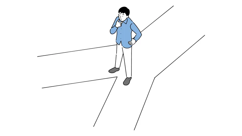 二つの道のうちどちらを選ぶか迷う男性