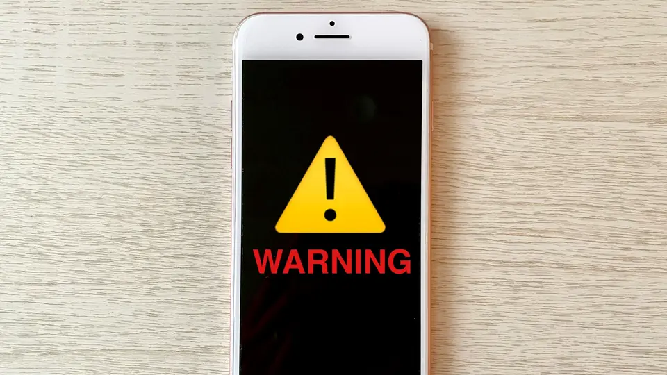 スマホとWARNING 警告マーク